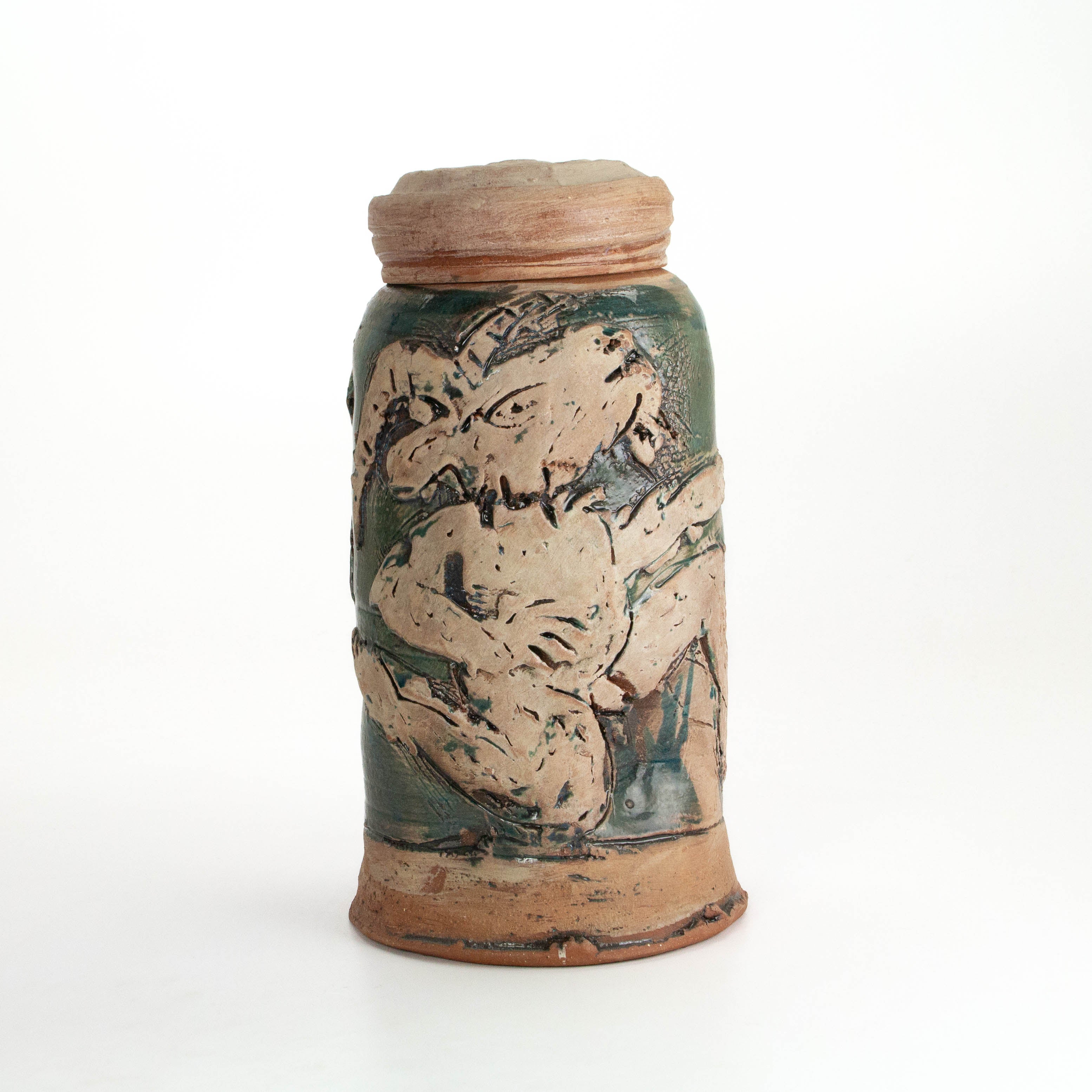 Tall Carved Lidded Jar: Dancing Goat and Femme